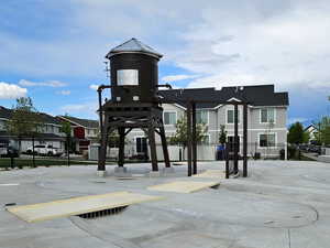View of home's community with fence and a residential view
