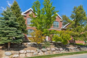 View of front facade featuring brick siding