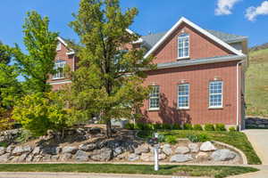 View of side of home featuring brick siding