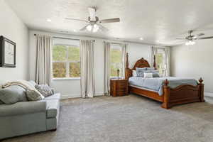 Bedroom featuring recessed lighting, a ceiling fan, visible vents, and carpet