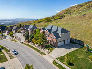 Drone / aerial view featuring a mountain view and a residential view