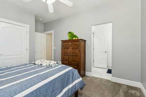 Bedroom with baseboards, ceiling fan, and marble finish floor