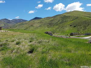 Property view of mountains with a rural view