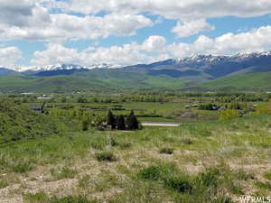 Property view of mountains featuring a rural view