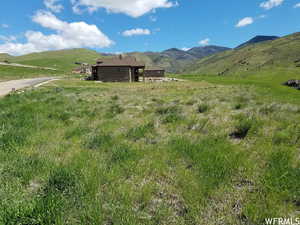 Property view of mountains with a rural view