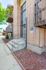 Doorway to property with brick siding
