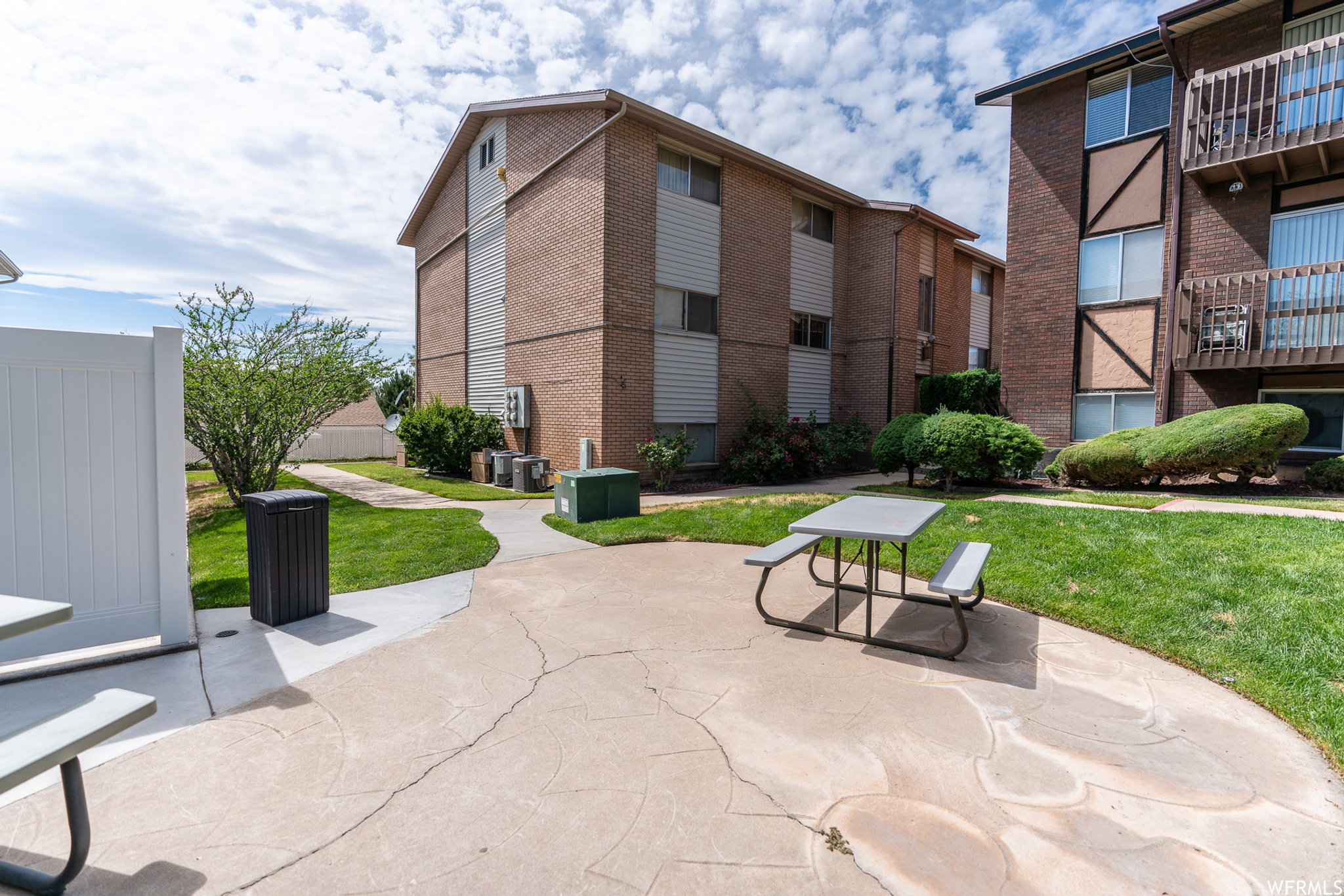 View of community featuring a yard and a patio