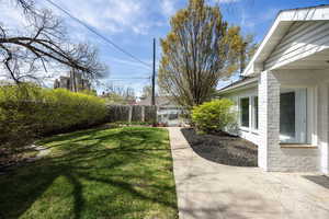 View of yard featuring fence