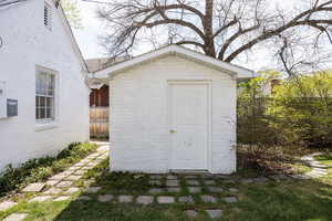 View of shed with fence