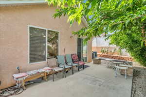 View of patio with fence