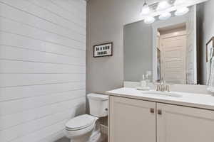 Bathroom featuring vanity and toilet