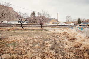 View of yard featuring fence