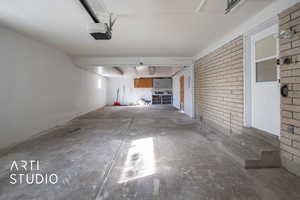 Garage featuring a garage door opener
