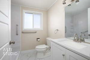 Bathroom with toilet, baseboards, walk in shower, marble finish floor, and vanity