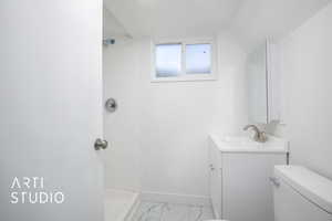 Bathroom with walk in shower, toilet, marble finish floor, vanity, and baseboards