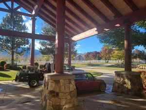 View of patio featuring fence
