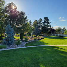 Surrounding community featuring a yard and fence