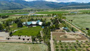 Birds eye view of property featuring a rural view and a mountain view