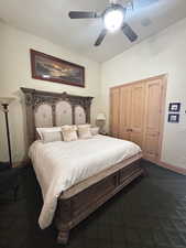 Bedroom with baseboards, dark carpet, a closet, and ceiling fan