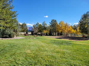 View of yard featuring a gazebo and volleyball court