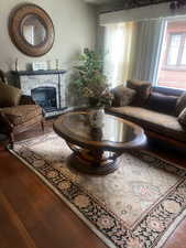 Living area featuring a fireplace and hardwood / wood-style floors
