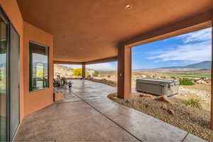 View of patio with a mountain view