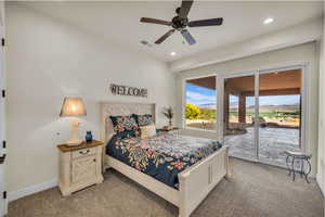 Bedroom featuring light colored carpet, recessed lighting, visible vents, and access to exterior