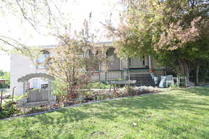 View of yard with covered porch