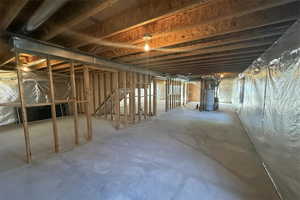 Unfinished basement with gas water heater