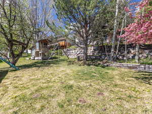View of yard featuring a wooden deck