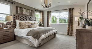 Primary bedroom with a notable chandelier, light carpet, and vaulted ceiling