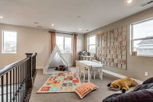 Loft with carpet flooring and recessed lighting