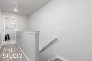 Staircase with carpet, baseboards, visible vents, and recessed lighting
