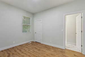 Unfurnished room featuring baseboards and visible vents