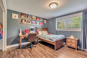 Bedroom with wood finished floors