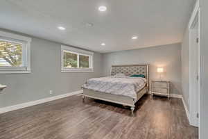Bedroom featuring recessed lighting, baseboards, and wood finished floors