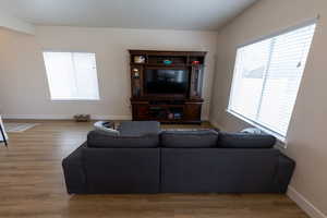 Living room with baseboards and wood finished floors