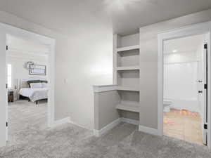 Upstairs hallway with built-in shelving