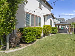 Backyard and covered hot tub and playset