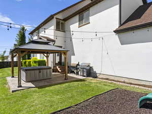 Covered stamped concrete pad with hot tub