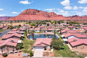 Aerial view of residential area featuring a water and mountain view
