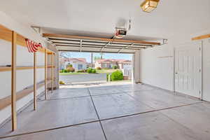 Garage with a residential view and a garage door opener