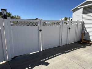 View of gate featuring fence