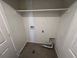 Laundry area with baseboards, hookup for an electric dryer, laundry area, and washer hookup