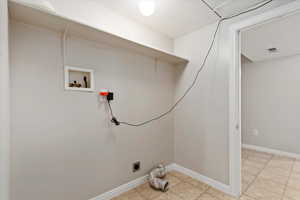 Basement Laundry/Utility room featuring washer hookup and hookup for an electric dryer.