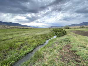 Property view of mountains with a rural view