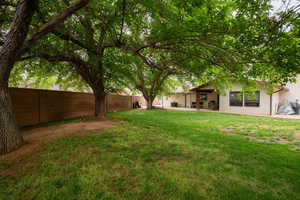 View of yard featuring a patio and a fenced backyard