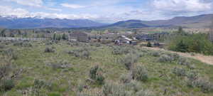 View of mountain backdrop with rural landscape