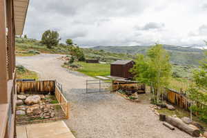 Fenced backyard with a mountain view and a gate