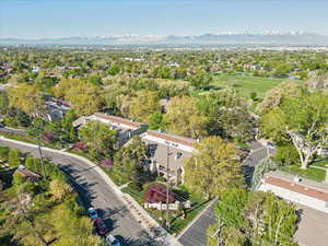 Aerial view featuring a mountain view and golf course view